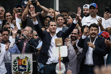Interim President Juan Guaido seen greeting the crowd after his speech during a rally against Nicolas Maduro government. Juan Guaido, the Venezuelan opposition leader, where many nations have recognized as the legitimate interim president of Venezuela, greets his supporters during a rally against the government of President Nicolas Maduro in Caracas.
