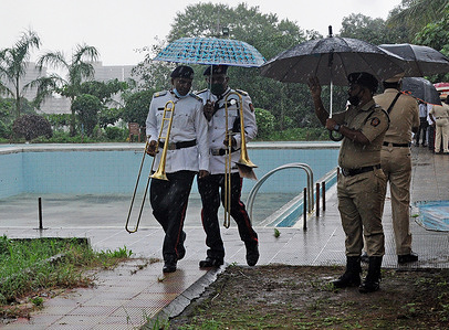 Police music band members run for shelter as it rains during the celebration.
India celebrated its 74th Independence Day. It is annually celebrated on 15th August as a national holiday commemorating the nation's independence from the United Kingdom on 15 August 1947.