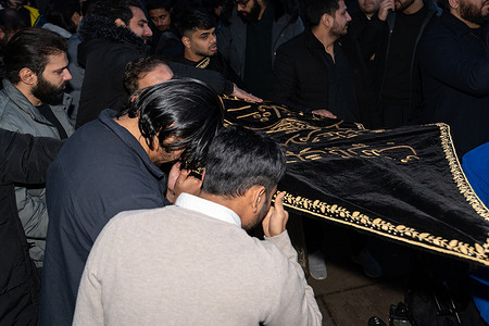 Worshippers pay their respects to the religious banner. Shia Muslims gathered at Westminster Bridge to commemorate the martyrdom of Imam Musa al-Kazim taking part in a religious procession marked by ritual chest beating known as Azadari and Matam. The annual observance honours the seventh Shia Imam and serves as a public expression of mourning, sacrifice, and devotion within the Shia Islamic tradition.