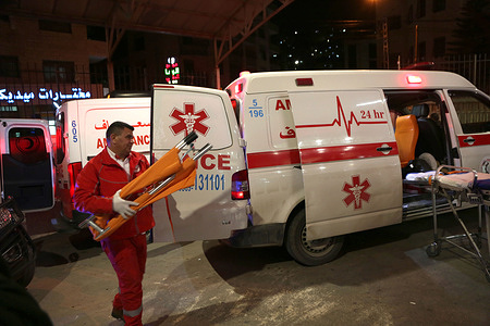 Ambulances that were used to transport three wounded Palestinians seen outside the emergency room after the Israeli forces opened fire on their car in the village of Einabus, south of Nablus. A fatal shooting south of Nablus in the occupied West Bank left 20-year-old Qais Sami Jasser Allan dead and three others seriously injured after Israeli forces opened fire on a Palestinian vehicle. The Palestinian Red Crescent Society said the car rolled over and caught fire following the gunfire between the villages of Einabus and Huwara, and the wounded were taken to Rafidia Surgical Hospital in Nablus. The Israeli military said troops fired after the driver allegedly attempted to ram soldiers, while Palestinian authorities began procedures to receive Allan’s body.