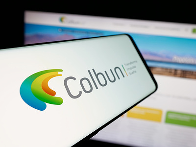 In this photo illustration, a smartphone with the logo of Chilean energy company Colbun S.A. is seen on screen in front of website.
