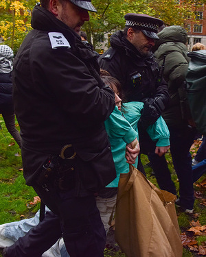 Police officers arrest a protester in Tavistock Square who was holding a placard in support of Palestine Action. Dozens of people gathered to show support for the activist group, which has been banned under anti-terrorism laws, as part of the Lift The Ban campaign by the organisation Defend Our Juries.