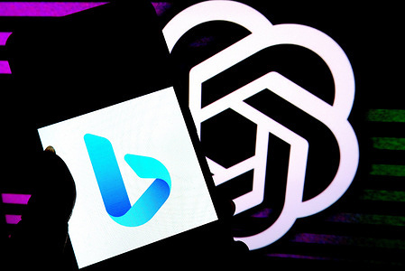 In this photo illustration, a Microsoft Bing logo is displayed on a smartphone with a Chat GPT logo in the background.