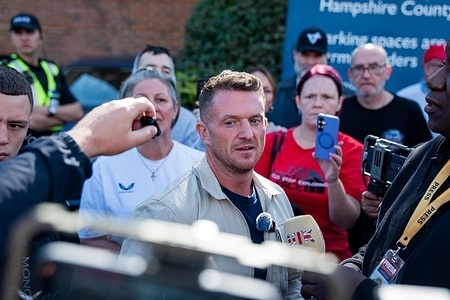 Tommy Robinson speaks to the press in defence of a friend and fellow anti-migrant activist Danny Tommo at his court hearing at Basingstoke Magistrates Law Court. Daniel Thomas (known as Danny Tommo), leader of anti-migrant group Patriot Platform, has pleaded not guilty to charges of criminal damage to a migrant dinghy.