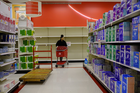 BLOOMINGTON, UNITED STATES - MARCH 10, 2020: An aisle that had toilet paper been completely cleared out by Coronavirus shoppers at a Target store in Bloomington. Shoppers have been panic buying toilet paper, cleaning supplies, wipes, paper towels, cold medicine, pain relievers, immune boosting vitamins, and other items on Coronavirus pandemic fears.