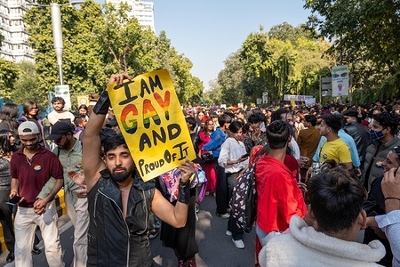 A participant from the LGBTQIA+ community holds a placard while taking part in the Queer Pride Parade at Tolstoy Marg, Connaught Place. The Queer Pride Parade brought together members of the LGBTQIA+ community and their allies in a vibrant march celebrating identity, love, and diversity. The parade moved from Barakhamba Road to Jantar Mantar, calling for equality, inclusion, and human rights. Usually held on the last Sunday of November, this year’s event was rescheduled following last year’s Red Fort blast, and highlighted the growing visibility of the queer community and its ongoing call for social acceptance and legal equality.