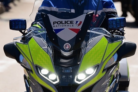 National police motorcyclist in the city of Chambery. National police motorcycle patrol in the city of Chambéry in the Savoie department of France.