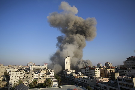 Smoke rises from a tower building destroyed by Israeli air strikes amid a flare-up of Israeli-Palestinian violence in Gaza City
Israel carried out hundreds of air strikes in Gaza on Wednesday and Palestinian militants fired multiple rocket barrages at tel aviv and the southern city of Beersheba in the region’s most intense hostilities in years.