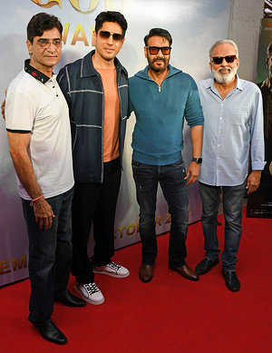 (L-R) Director Indra Kumar, Bollywood actor Sidharth Malhotra, Ajay Devgn, and Producer Ashok Thakeria pose for a photo at the unveiling of the trailer of their upcoming film 'Thank God' in Mumbai. The film will release in theaters on 25th October 2022