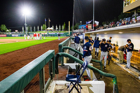 The Reno Aces celebrate a win while the Tacoma Rainiers pack up, during the Reno Aces vs the Tacoma Rainiers game at Greater Nevada Field.
(Final score: Reno Aces 8-7 the Tacoma Rainiers).