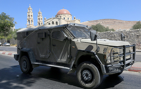 Israeli military vehicle passed by the Greek Orthodox Church during a raid on the Balata refugee camp east of Nablus in the West Bank. Raids and arrests targeting Palestinians in refugee camps located in areas under the control of the Palestinian Authority, headed by President Mahmoud Abbas, have intensified. Local residents reported the arrest of dozens of young Palestinians during raids in the Nablus area and its three camps: Askar, Balata, and Ein, in the northern West Bank.
