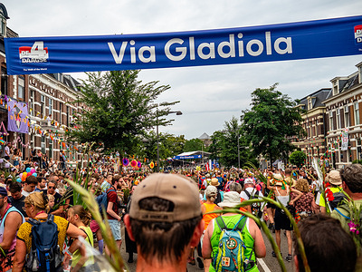 Walkers are seen walking the last kilometers. The International Four Days Marches (in Dutch 'De Vierdaagse') is the world’s biggest multi-day walking event, and is seen as the prime example of sportsmanship and international bonding between military service people and civilians from many different countries. This year, because of hot temperatures, all the routes were shorter by 10 km on the last day.