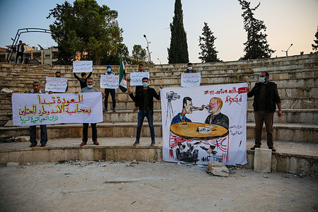 Activists holding banners and placards expressing their opinion during the demonstration.
Syrian activists in the city of Idlib organize a protest to express their rejection of the "return of refugees" conference called by Russia and the Syrian regime.