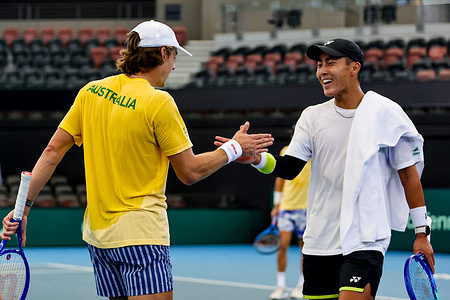 Alex De Minaur and Rinky Hijikata seen after their practice match at Pat Rafter Arena . Australian Davis Cup Team training prior to their World Group I tie versus Poland. The Round is being held at Pat Rafter Arena.