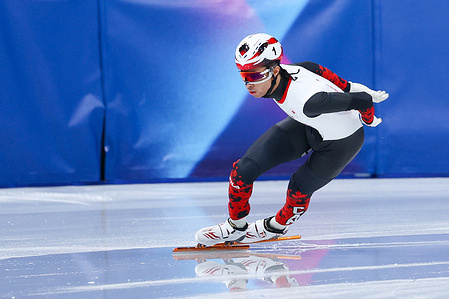 William Dandjinou of Canada competes during the Short Track Speed Skating Men's 1000m Heats of the Milano Cortina 2026 Winter Olympics at Milano Ice Skating Arena in Milan