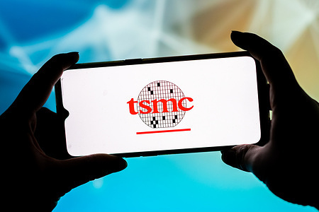 In this photo illustration a Taiwan Semiconductor Manufacturing Company Limited (TSMC) logo seen displayed on a smartphone.