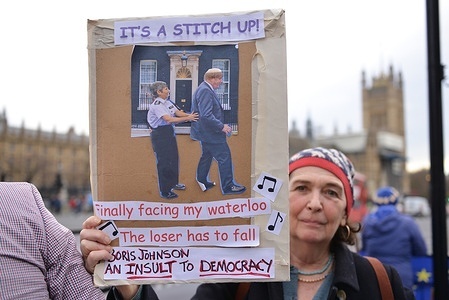 A protester seen holding a placard expressing her opinion outside the Houses of Parliament during the demonstration.
Anti government demonstrators, protested at Westminster as Boris Johnson takes part in Prime Minister's Questions.
