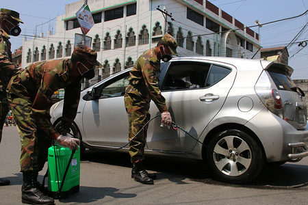 An army soldier sprays disinfectants onto a car amid concerns about the spread of coronavirus disease (COVID-19) in Dhaka.
Bangladesh has confirmed 48 cases, with 5 deaths due to corona virus (COVID-19), According to the IEDCR officials.