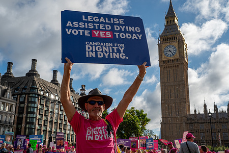 A campaigner opposed to the assisted dying bill holds a placard outside the Houses of Parliament during the debate and vote on the Terminally Ill Adults (End of Life) Bill. Protesters from opposing sides of the assisted dying debate gathered outside the Houses of Parliament in Westminster, London, as MPs prepare to vote on the Terminally Ill Adults (End of Life) Bill. Supporters of legalising assisted dying are campaigning for terminally ill adults to have the choice to end their lives, while opponents argue proposed safeguards are insufficient to protect vulnerable people from coercion. The bill would apply to adults with less than six months to live.
