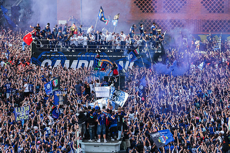 FC Internazionale players and staff parade the Coppa Campioni d'Italia and Coppa Italia trophies on an open top bus following the Serie A 2025/26 football match between FC Internazionale and Hellas Verona FC at San Siro Stadium.