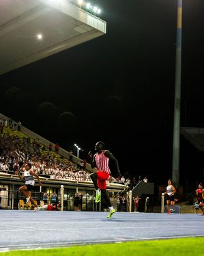 Australian athlete Gout Gout runs in front of his teammates in the grandstand during his final relay race for Ipswich Grammar School. Australian sprint sensation Gout Gout swept his individual events and anchored Ipswich Grammar School to victory in the 4x100m relay to secure the team title at the Great Public Schools Association (GPS) Track and Field Championships.
