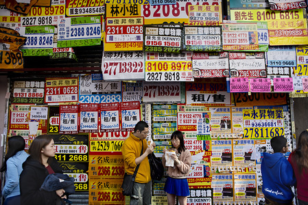 Closed shop covered with advertising signs for store rental properties in Kowloon's Prince Edward district.
Hong Kong has the highest levels of income disparity in the developed world. In recent years, the situation among the poor has gotten worse, resulting in an increasing number of unemployed young adults and single elderly.