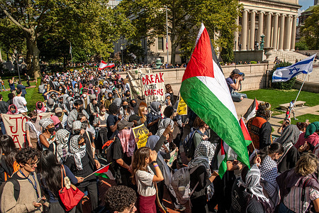 Pro-Palestinian Columbia university students march through the university's courtyard. During the mass nationwide Hand's-Off protest, thousands of people gathered to march against the recent changes made by the Trump administration that are now affecting Americans across the country.