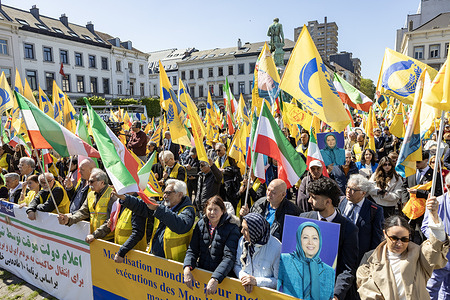 An overview of the demonstration crowd in Luxembourg Square in solidarity with political prisoners in Iran. Supporters of the National Council of Resistance of Iran (NCRI) rallied outside the European Parliament in Brussels, against the clerical regime's critical surge in political executions. Demonstrators displayed portraits of recently executed victims and urged the European Union to hold Tehran accountable for its human rights violations. The rally called for an immediate halt to the crackdown and emphasized the role of the organized resistance in achieving a free, secular, and democratic republic.