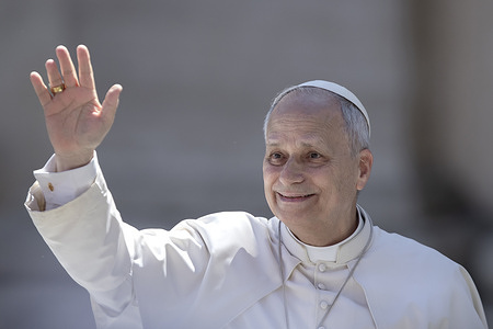 Pope Leo XIV greets the faithful from the papamobike at the end of Easter Sunday celebrations at St. Peter's Square.