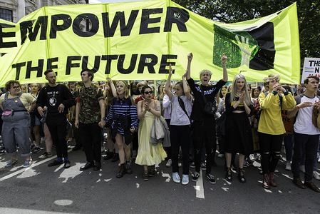 Students chant slogans while holding a banner at the Parliament Square during a March.
Students gathered at Parliament Square and marched through central London demanding from the government and politicians direct actions to tackle the climate change.