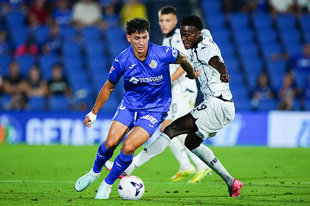 Martin Satriano of Getafe CF and Demba Sek of FK Partizan seen in action during the UEFA Conference League 2026/27 play-offs first leg match between Getafe CF and FK Partizan at Estadio Coliseum. Final score Getafe 3 : 1 Partizan
