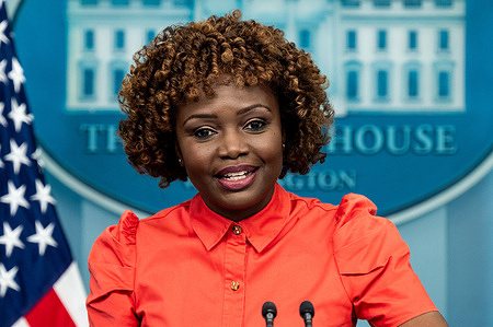 White House Press Secretary Karine Jean-Pierre speaking at a press briefing in the White House Press Briefing Room.