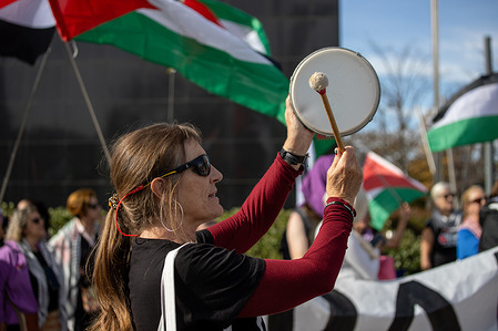 A protester strikes a kind of tambourine during the demonstration. A rally of pro-Palestinian activists in front of the British Embassy in Madrid, commemorating the 108th anniversary of the Balfour Declaration, under the slogan: "Great Britain, responsible for colonialism in Palestine".