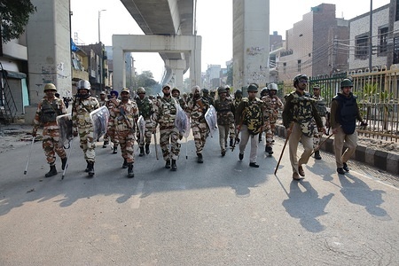 Paramilitary troopers patrol streets during the protest against the Citizenship Amendment Act (CAA) and the National Register of Citizens (NRC) at Jaffrabad area in New Delhi.