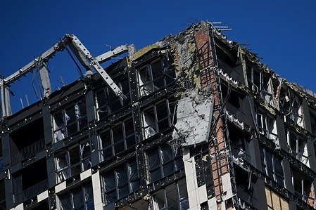 Damaged residential building from a Russian missile strike in Kyiv. Russia fired missiles and drones into apartment buildings in Kyiv for the second time in a week on Monday morning, killing at least 14 people on the eve of a crucial NATO summit, authorities said.