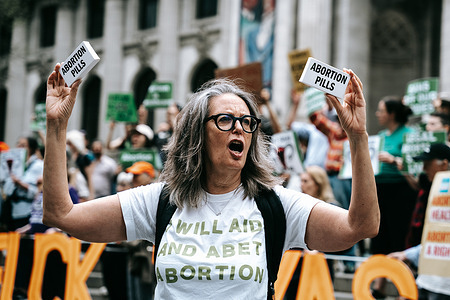A protester holds up a box labeled "abortion pills" on Saturday, April 15, 2023 in New York, NY. on Saturday, April 15, 2023 in New York, NY. Abortion rights activists throughout the United States rally against the controversial decision of Judge Matthew Kacsmaryk of the U.S. District Court in Amarillo, Texas, who overruled the FDA approval of abortion medication mifepristone.
