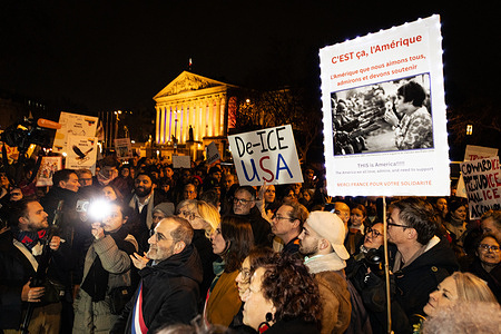 A placard that says "De-ICE" seen in the middle of the crowd during the demonstration against Donald Trump and the federal anti-immigration police force ICE in front of the National Assembly. Dozens of people protested in front of the National Assembly and the Ministry of Foreign Affairs against Donald Trump and the federal anti-immigration police force ICE. At a time of great social tension in the United States after ICE agents shot and killed Renee Good and Alex Pretti in Minneapolis, Minnesota.