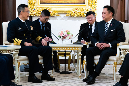 Chinese Defense Minister Admiral Dong Jun (L) speaks with Thai Prime Minister Anutin Charnvirakul (R) during a meeting at Government House in Bangkok.