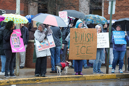 Anti-ICE demonstrators hold placards during the "ICE Out for Good" protest outside of the Columbia County Courthouse. The demonstration was part of a national weekend of protest in the United States after a federal agent shot and killed Renee Nicole Good on January 7 in Minneapolis.
