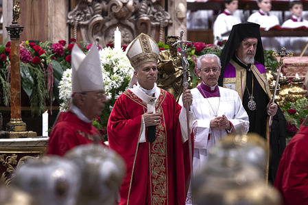 Pope Leo XIV leaves at the end of the Eucharistic celebration on the solemnity of Saints Peter and Paul with the blessing and imposition of the pallia to the new metropolitan archbishops, at St. Peter's Basilica.