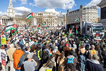 Thousands of protesters with placards and flags descend in London's Trafalgar Square during the demonstration calling for a ceasefire in Gaza