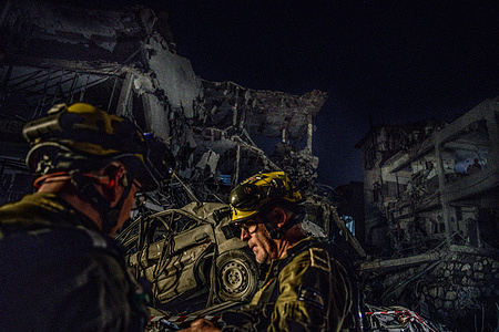 Israeli Home Front Command soldiers inspect a building that was directly hit by an Iranian ballistic missile. Israel launched a sweeping assault on the heart of Iran’s nuclear and military structure, deploying warplanes and drones previously smuggled into the country to strike key facilities, kill top generals and scientists. A barrage, it said, was necessary before its adversary got any closer to building an atomic weapon. Iran retaliated by unleashing scores of ballistic missiles on Israel, where explosions flared in the skies over Jerusalem and shook the buildings below.