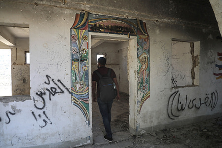 A Palestinian seen inspecting inside a room that was abandoned in Sa Nur of the northern West Bank. Israel pulled out of Sa-Nur in 2005. But during a recent visit to Sa Nur, Israeli Defense Minister Israel Katz announced the planned construction of 22 new illegal settlements across the West Bank. The move was in defiance of international criticism of Israel.
