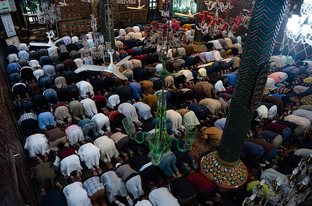 Muslims offer Friday prayers inside a shrine during Ramadan. Islam's holiest month Ramadan is a period of intense prayer, dawn-to-dusk fasting and nightly feasts.