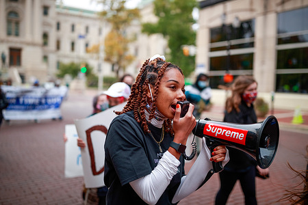 Taylor Hall leads a march from the statehouse to the city county building while using a mega phone during the rally of the Crossroads of Democracy: Day of Action" outside the Indiana Statehouse on Saturday.
More than 100 demonstrators gathered for the Crossroads of Democracy: Day of Action" rally outside Indiana Statehouse. The rally was organized by the Indiana Nasty Women, and Indiana Black Legislative Caucus, and coincided with Women Day events across the United States to empower young Hoosiers and improve voter turnout.