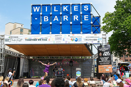 Drag artist Trixy Valentine performs on the main stage at the NEPA PrideFest on Wilkes-Barre's Public Square. NEPA PrideFest, organized by the Rainbow Alliance, is a vibrant annual celebration in Northeastern Pennsylvania that encompasses a diverse range of activities, typically held in late June. The main festival day, which in 2025 falls on Sunday, June 22nd, features a colorful parade through Downtown Wilkes-Barre, followed by a lively celebration on Public Square, complete with live entertainment, a variety of food trucks, local craft vendors showcasing their goods, and booths representing numerous community organizations, all coming together to honor and support the LGBTQ+ community in a welcoming and inclusive atmosphere.