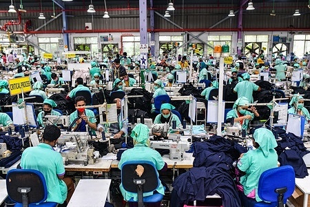 Garment workers work in a sewing section of the Fakhruddin Textile Mills Limited in Gazipur.
All garment workers work following the rules and regulations during the coronavirus pandemic.