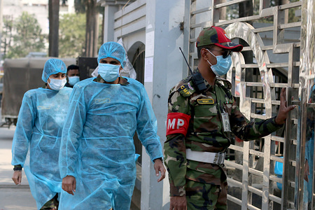 Security personnel wearing face masks as they enter the quarantine centre.
Bangladeshi government returns 314 of its citizens from China because of the Corona-virus epidemic. To observe deeply these 314 people the government has put them at a quarantine centre close to Hazrat Shahjalal International airport in Dhaka.