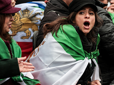 Pro-democracy iranian woman celebrates during a demonstration outside Iranian Embassy in London in solidarity with the regime change in Iran. A demonstration is staged for a second day in the face of Israeli and the US attack on Iran. Early Saturday morning (February 28) the USA and Israeli forces started an air attack on Iran. Iranian supreme leader Ali Khomenei as well as many prominent Iranian politicians were killed in the attack. Iran immediately initiated retaliatory air strikes. Pro-democratic Iranians on the protest think that the US-Israel military operation opened the path for the change of the Islamic regime. They support Reza Pahlavi as the natural successor of power in Iran.