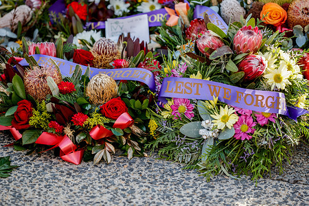 Wreaths laid at the Cairns Cenotaph during the service on ANZAC Day. Current and retired Australian Defence Force members and their families took part in the ANZAC Day dawn service at the Cairns Cenotaph and march along Cairns Esplanade organized by the Cairns RSL (Returned and Services League of Australia) on the 25th of April 2024.
Though ANZAC Day was initially to commemorate those lost during the Gallipoli campaign during the First World War, it is now marked in remembrance of all service people killed in military actions.